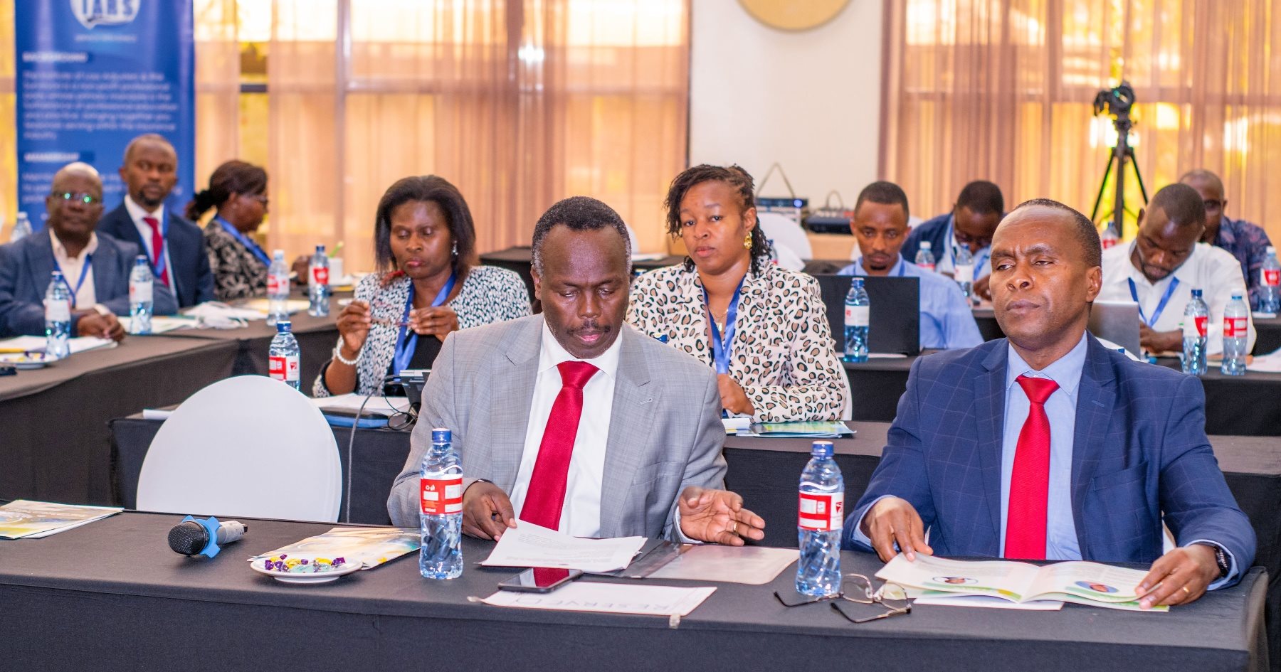 IARS delegates in discussion during a conference session
