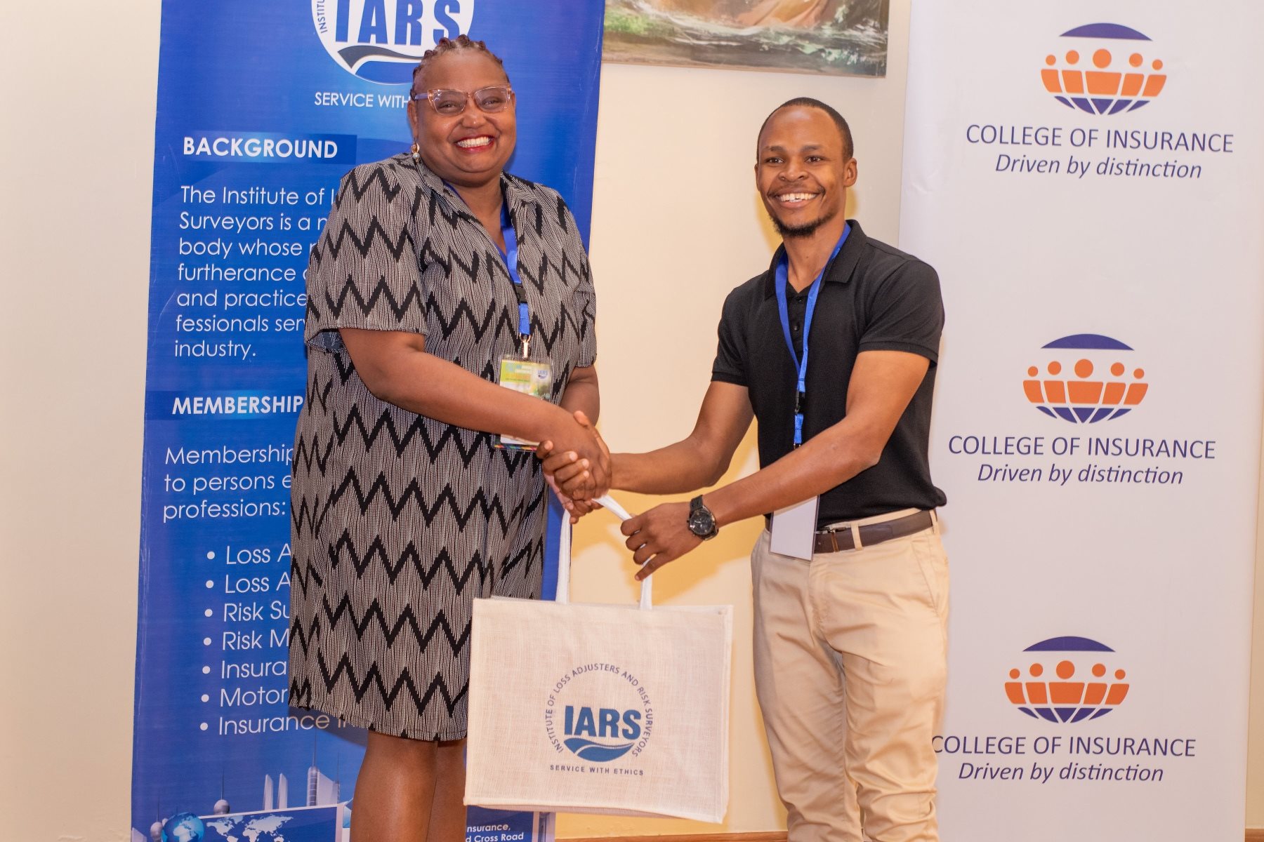 IARS members exchanging conference gifts with College of Insurance