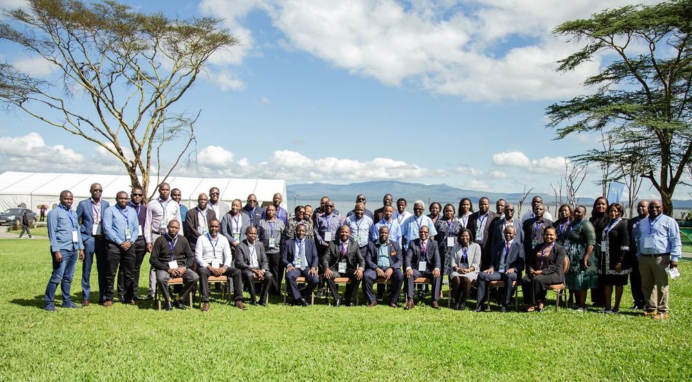 IARS leadership seated lakeside at a conference
